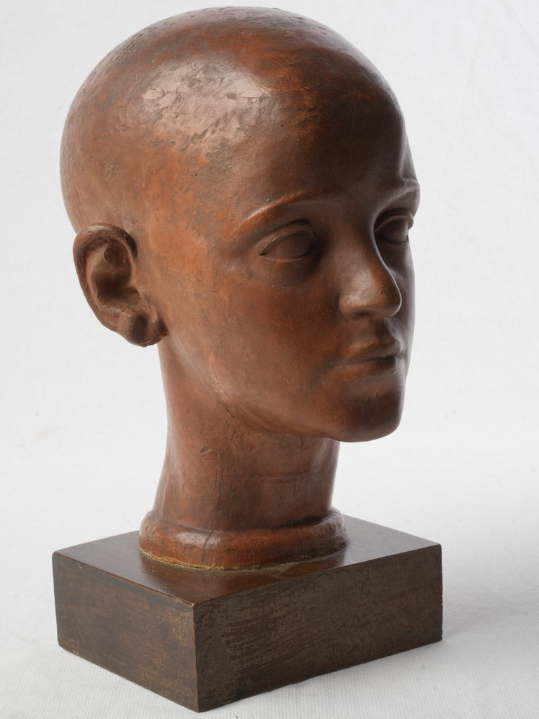 Warm-toned terracotta head sculpture
