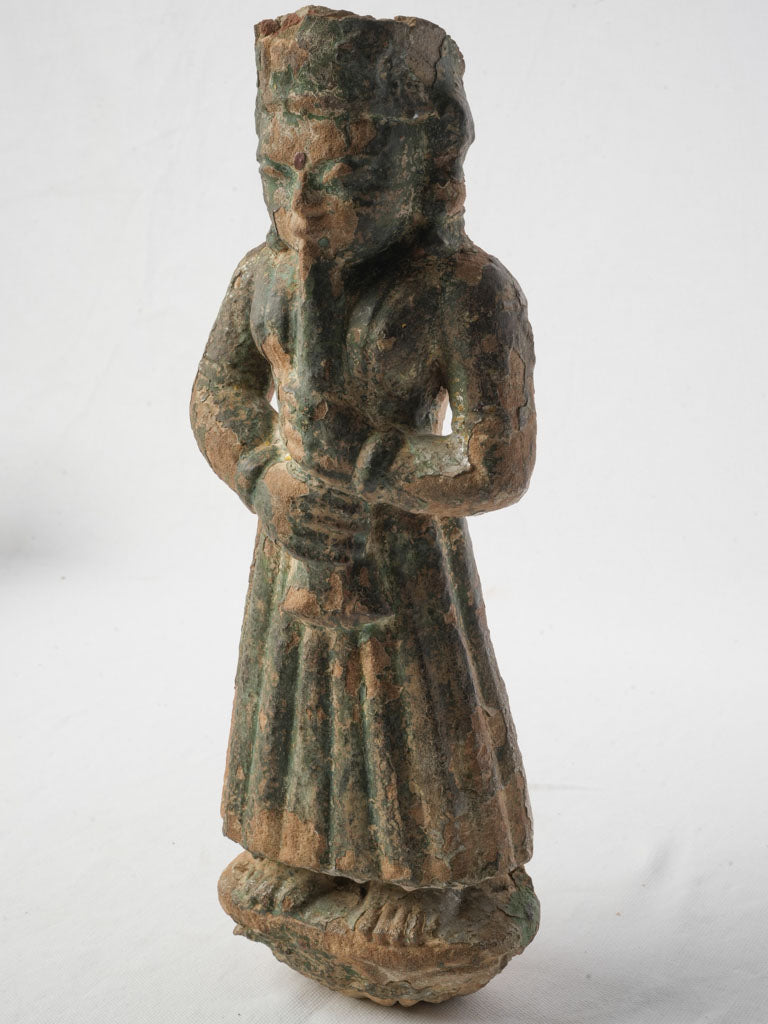 Soulful painted stone figurine