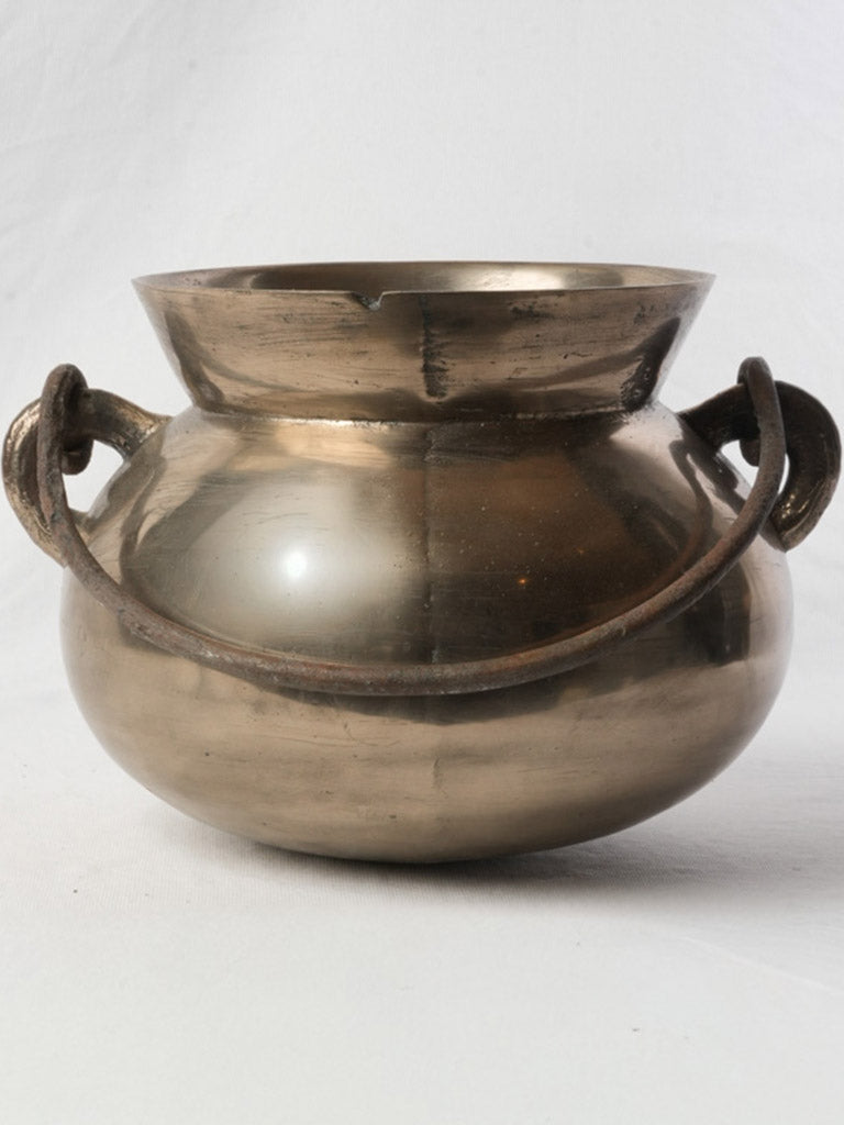 Aged handcrafted bronze vessel