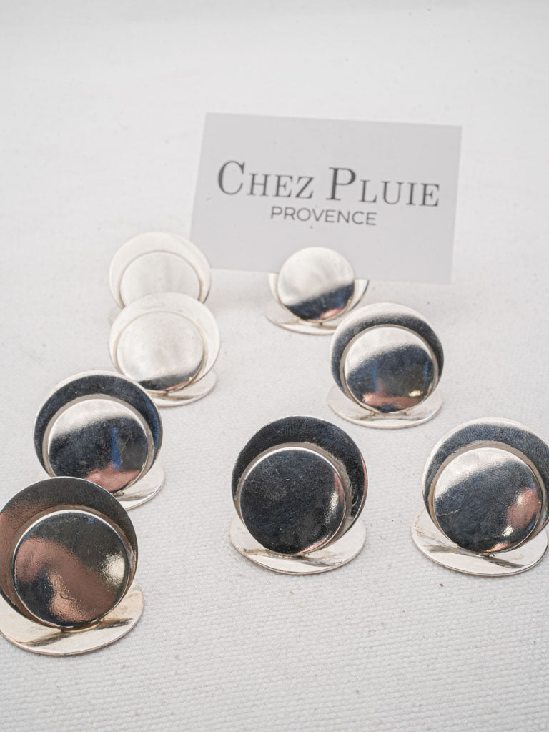 Sleek silver sculptural place holders