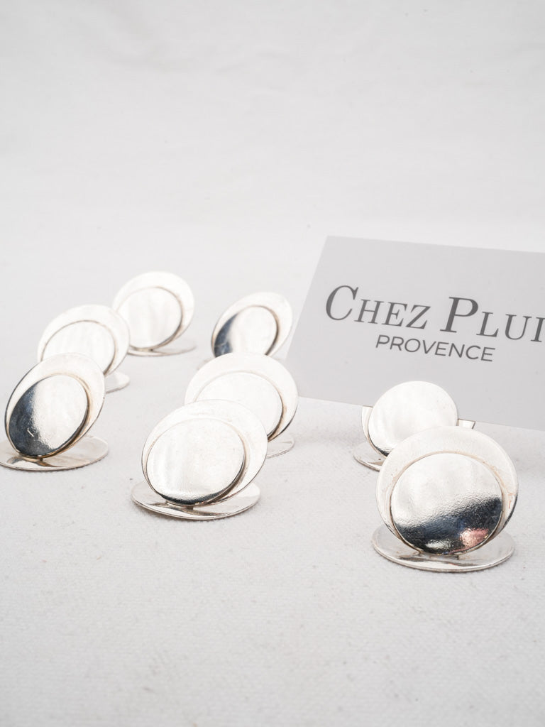 Shiny sculptural silver card holders