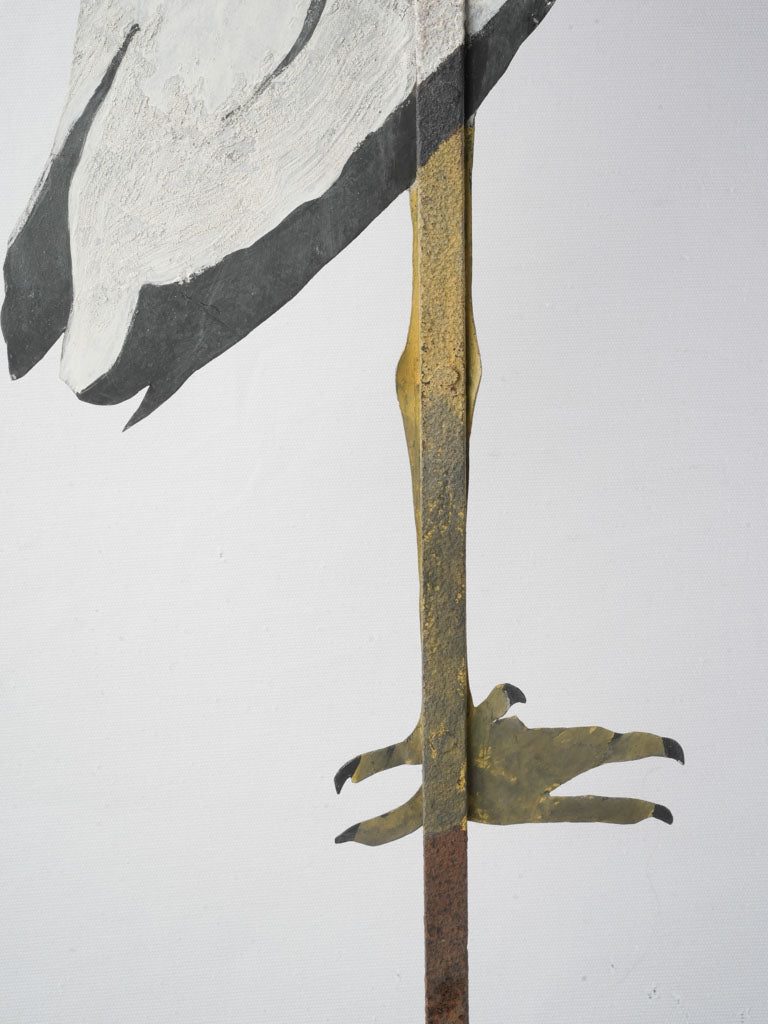 Whimsical painted metal sheet heron