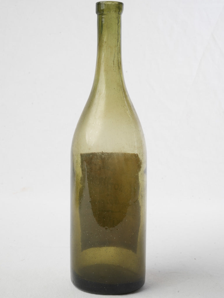 Artisanal olive-hued absinthe container