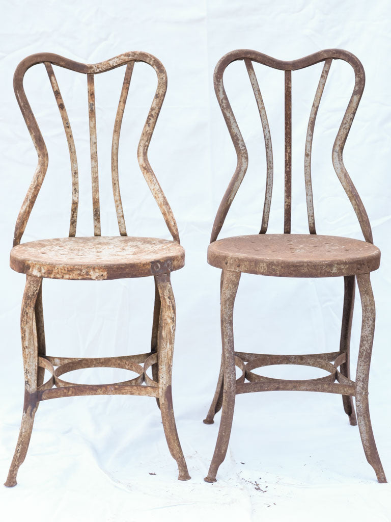 Aged patina heart-back chairs