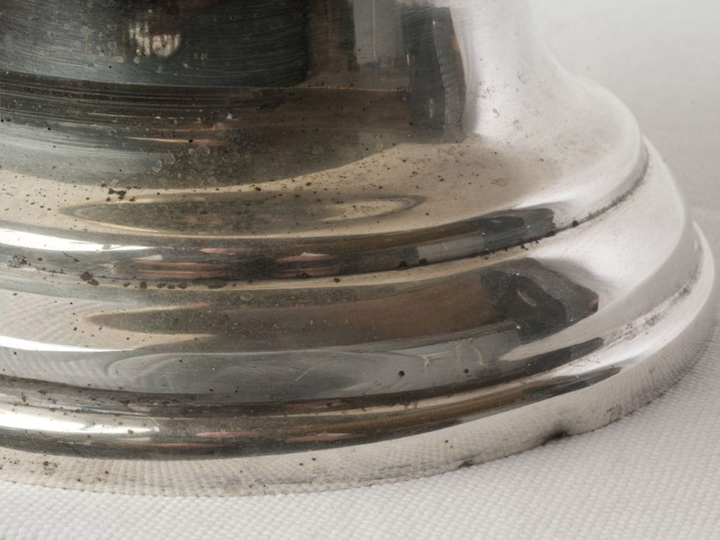 Reflective sculptural silver ice cooler