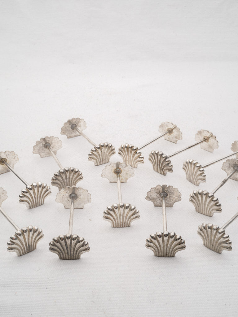 Playful coastal-inspired silver knife rests