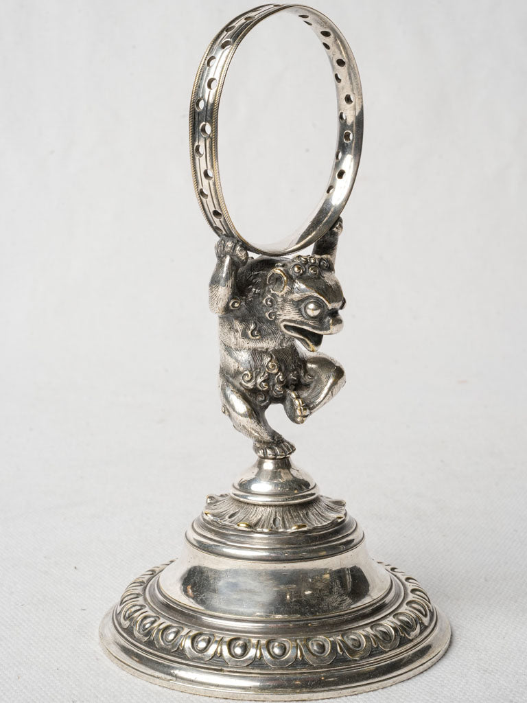 Ornate bronze pick holder sculpture