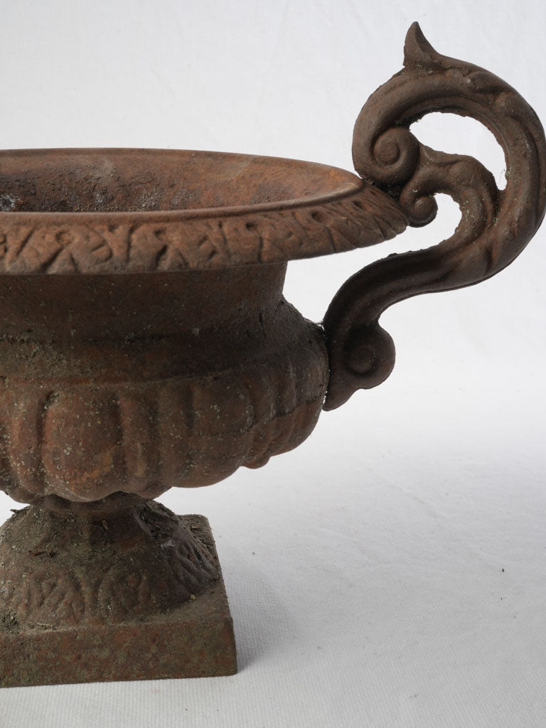 Gadrooned antique iron urn