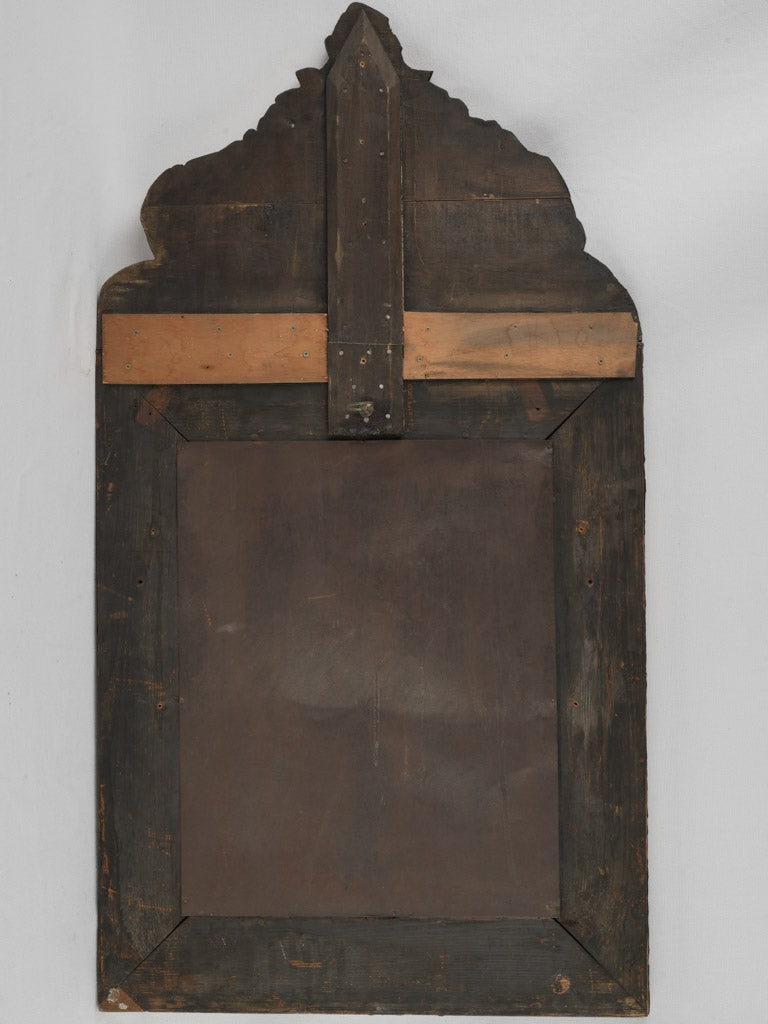 Aged repoussé mirror with perokeets