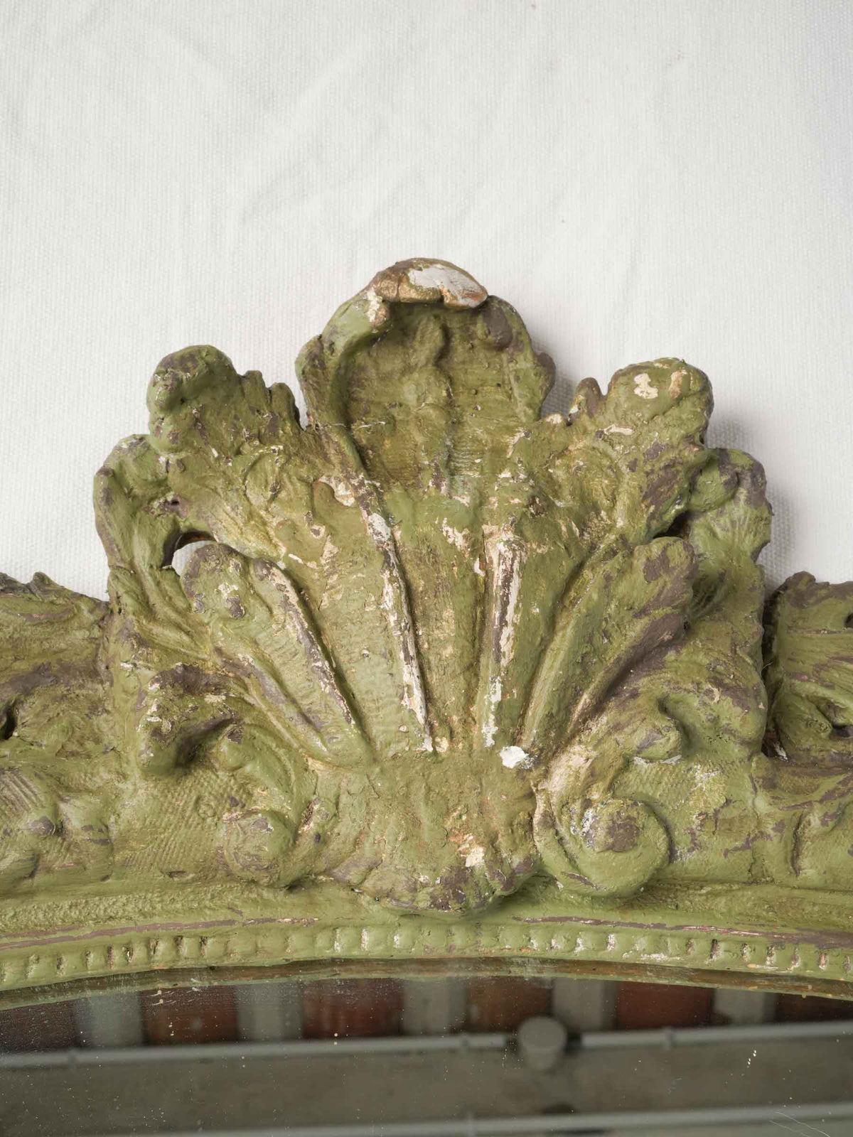Distressed wooden Louis XV mirror.