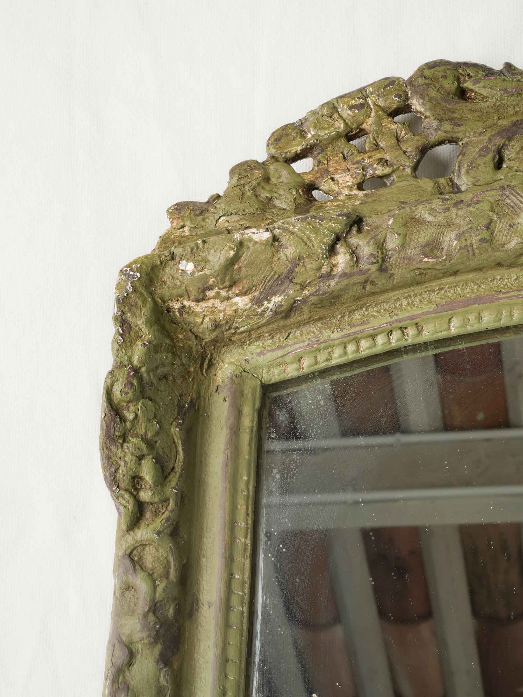 Hand-carved foliate detailed mirror.