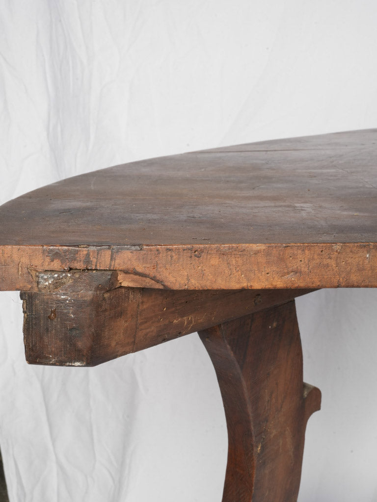 Flowing silhouette demi-lune table