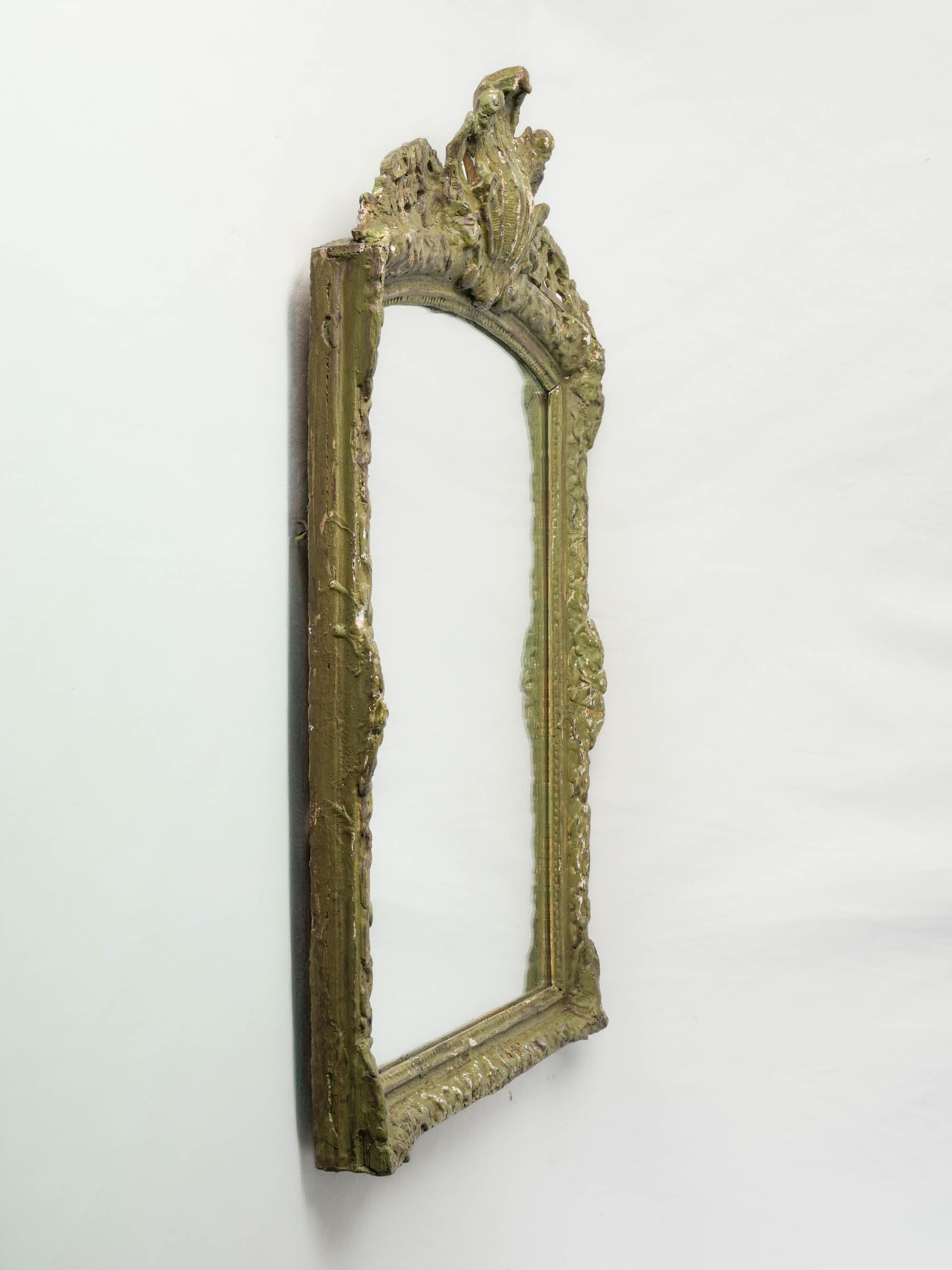 Decorative worn green mirror.