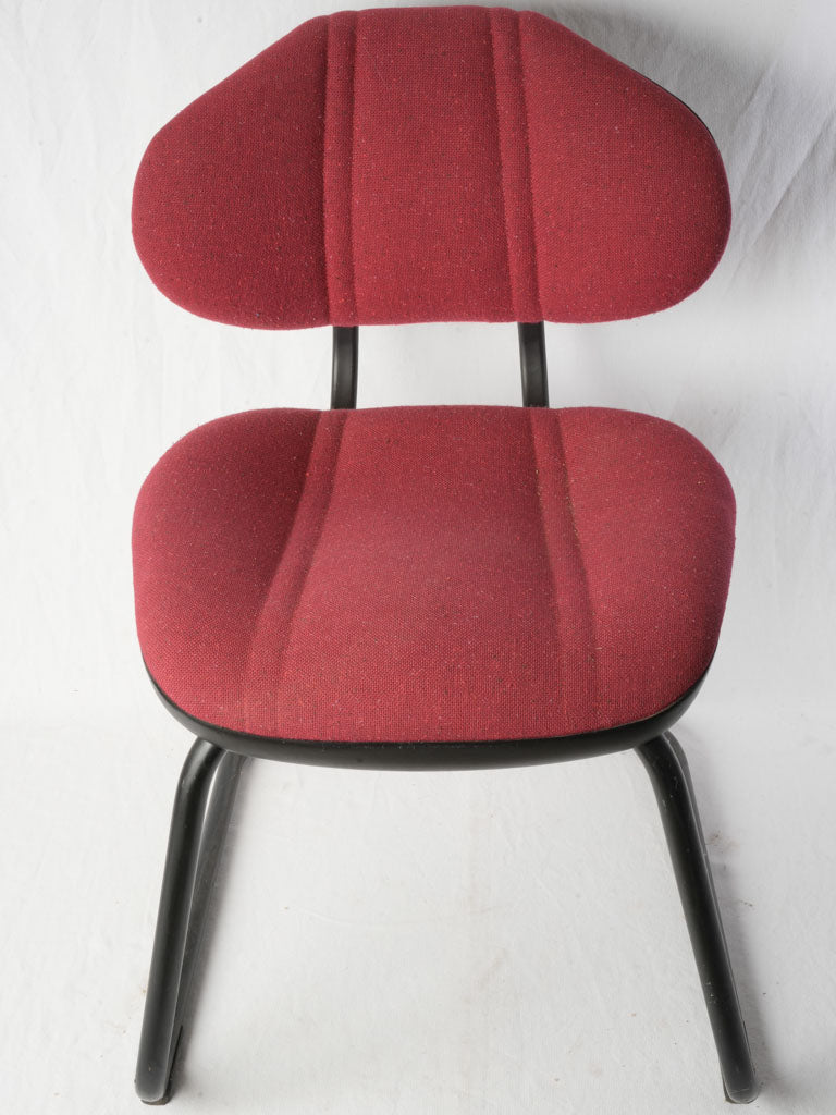 Deep red tubular chairs