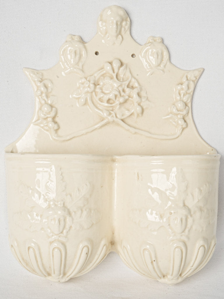 Antique off-white faïence cutlery strainer