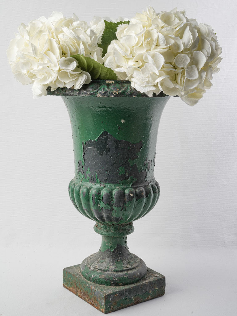Weathered green Medici-style urn