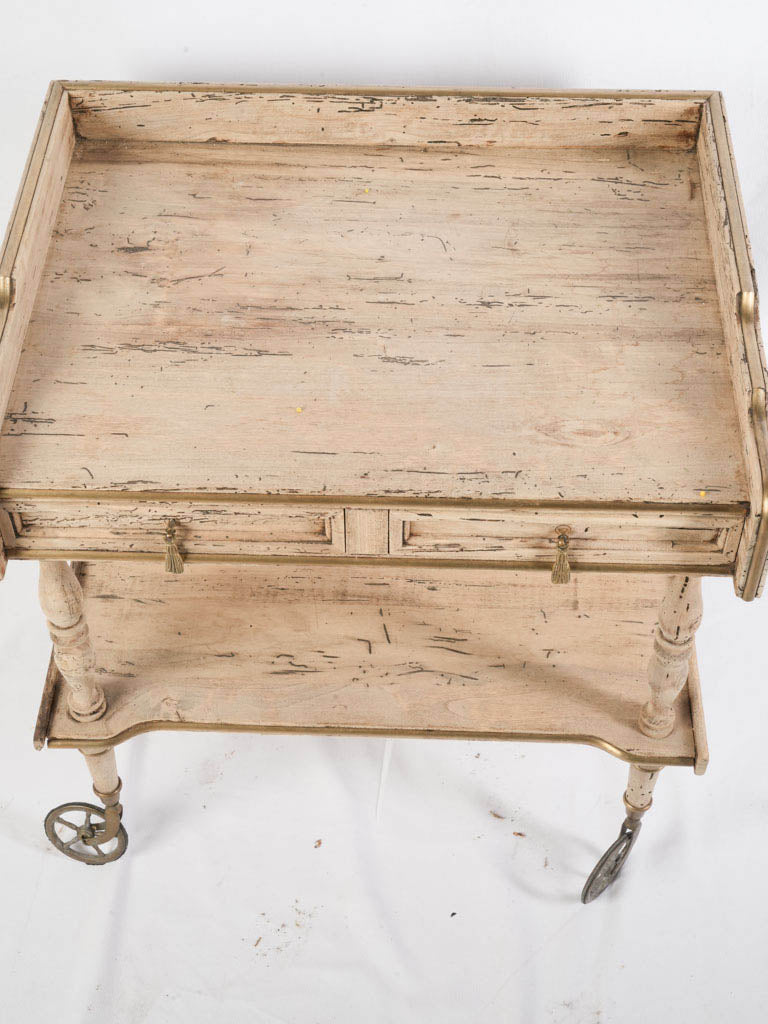 Subtly gilded framed gallery table