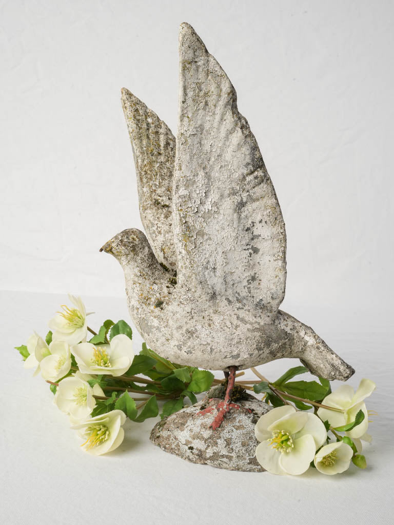 Antique lichen-covered concrete sculpture