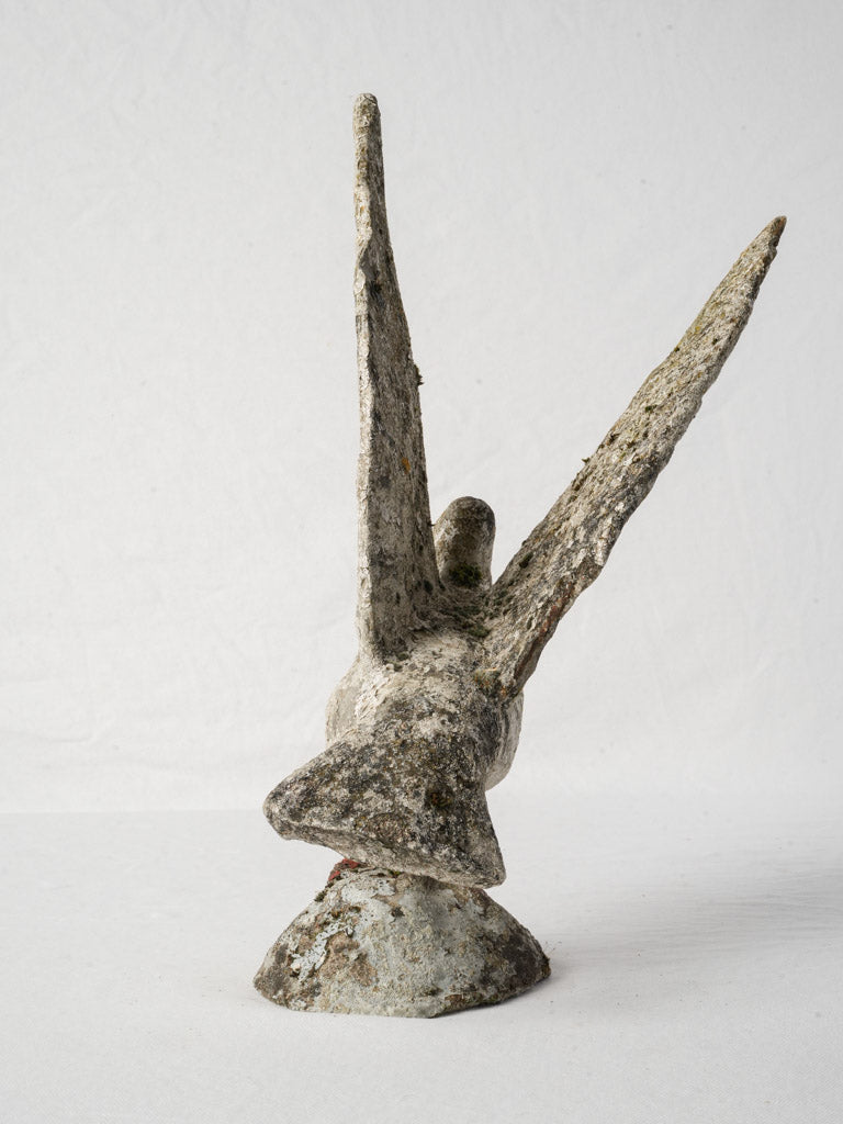 Historic painted concrete bird statue