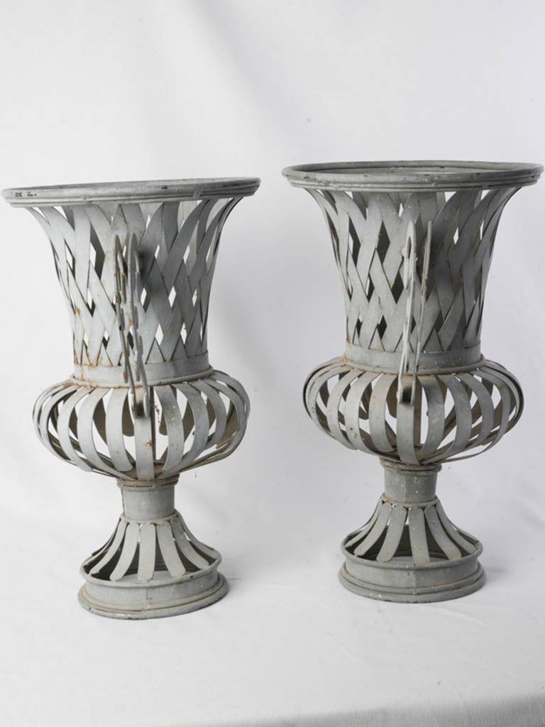 Bold scrolling-handle urns