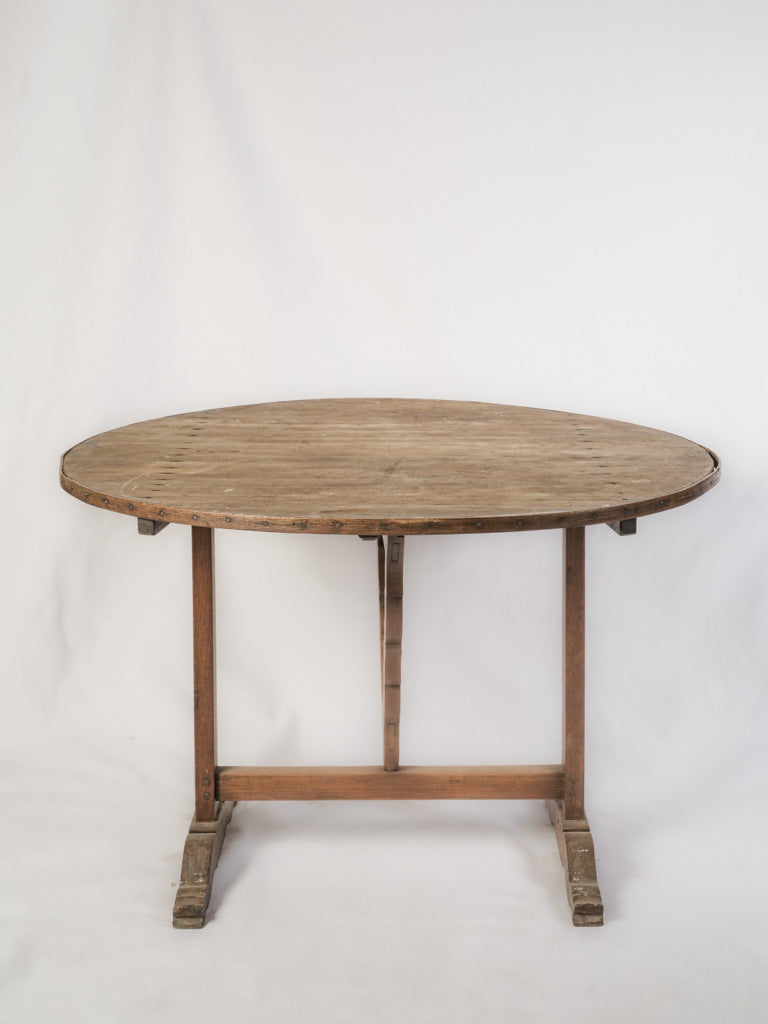 Warm patina round oak table