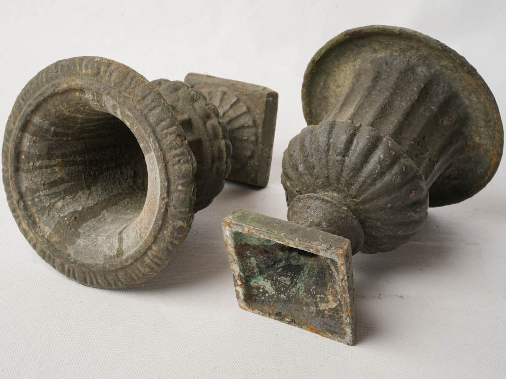 Subtle antiqued fluted urns