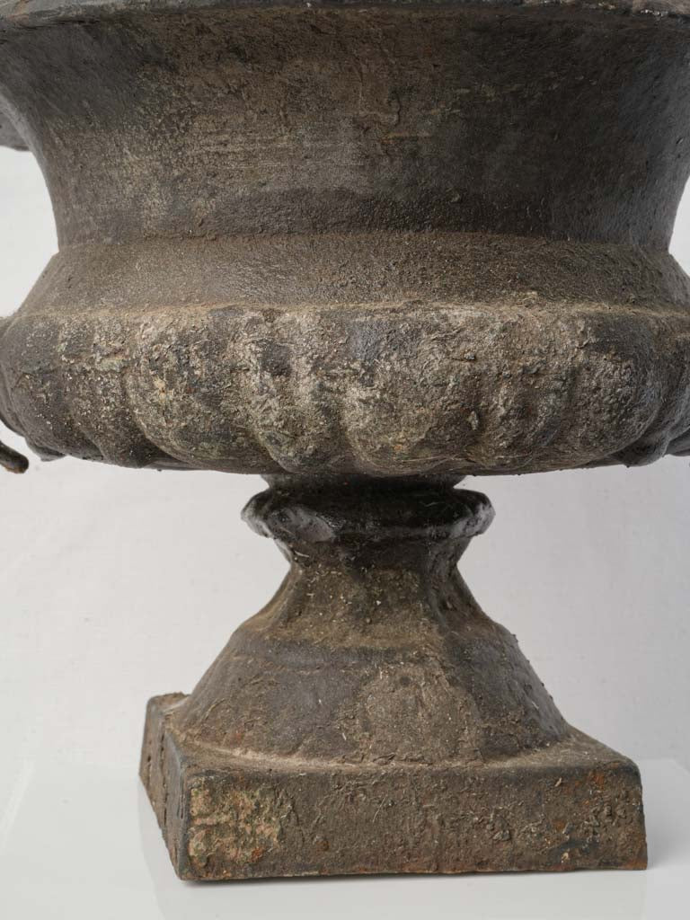 Timeworn cast iron urns