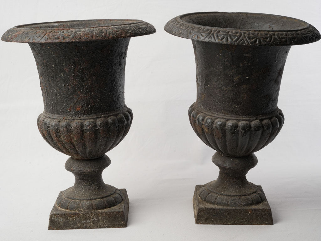 Classic ornate iron garden urns