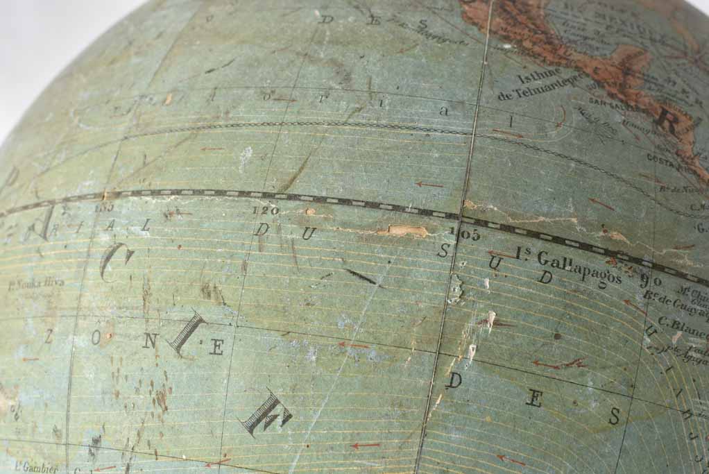 Globe with antique aesthetic and iron base