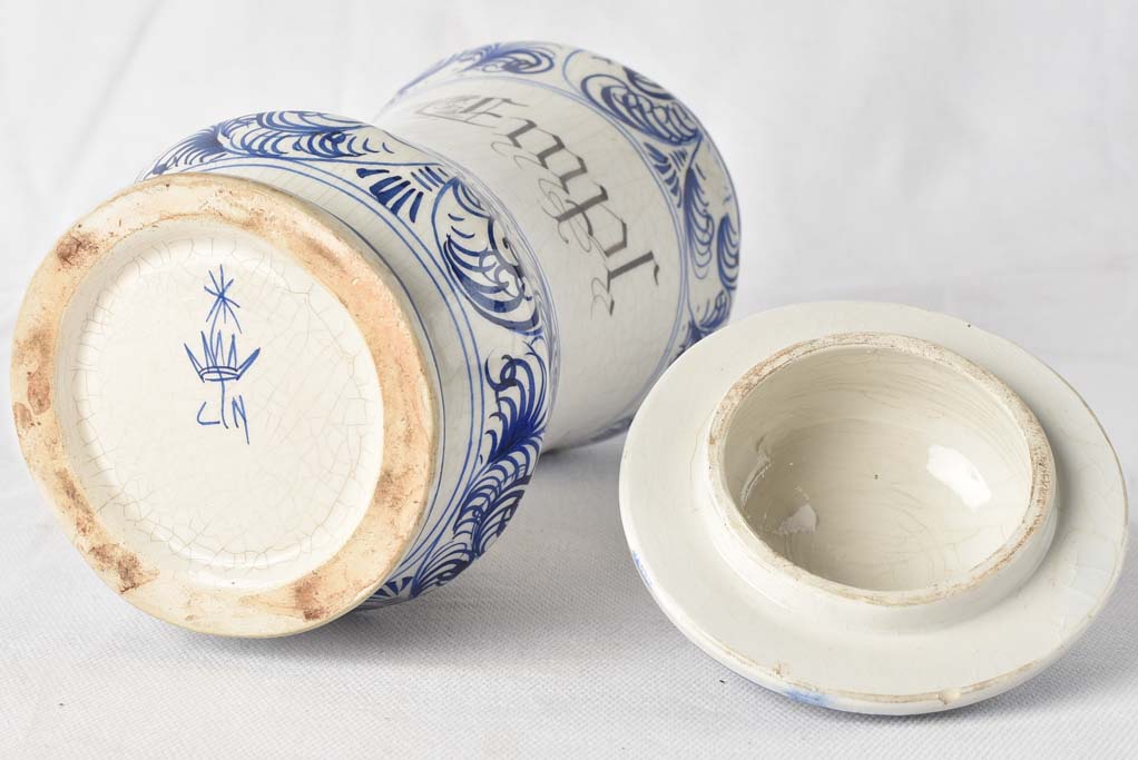 Blue, white ceramic jar with flower