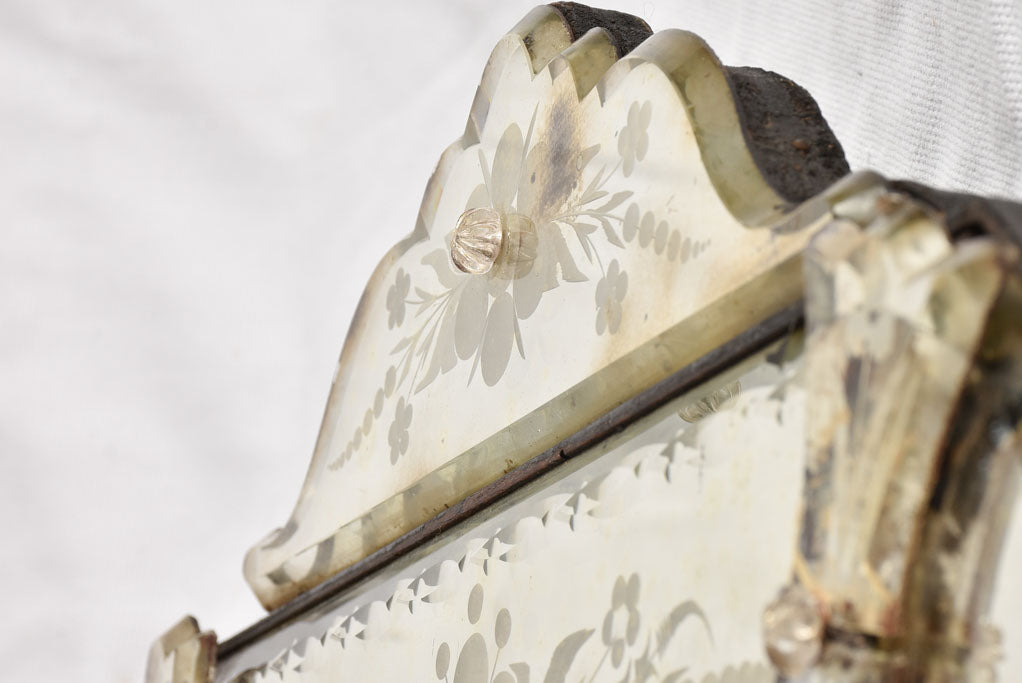 Complete Venetian mirror with aging spots