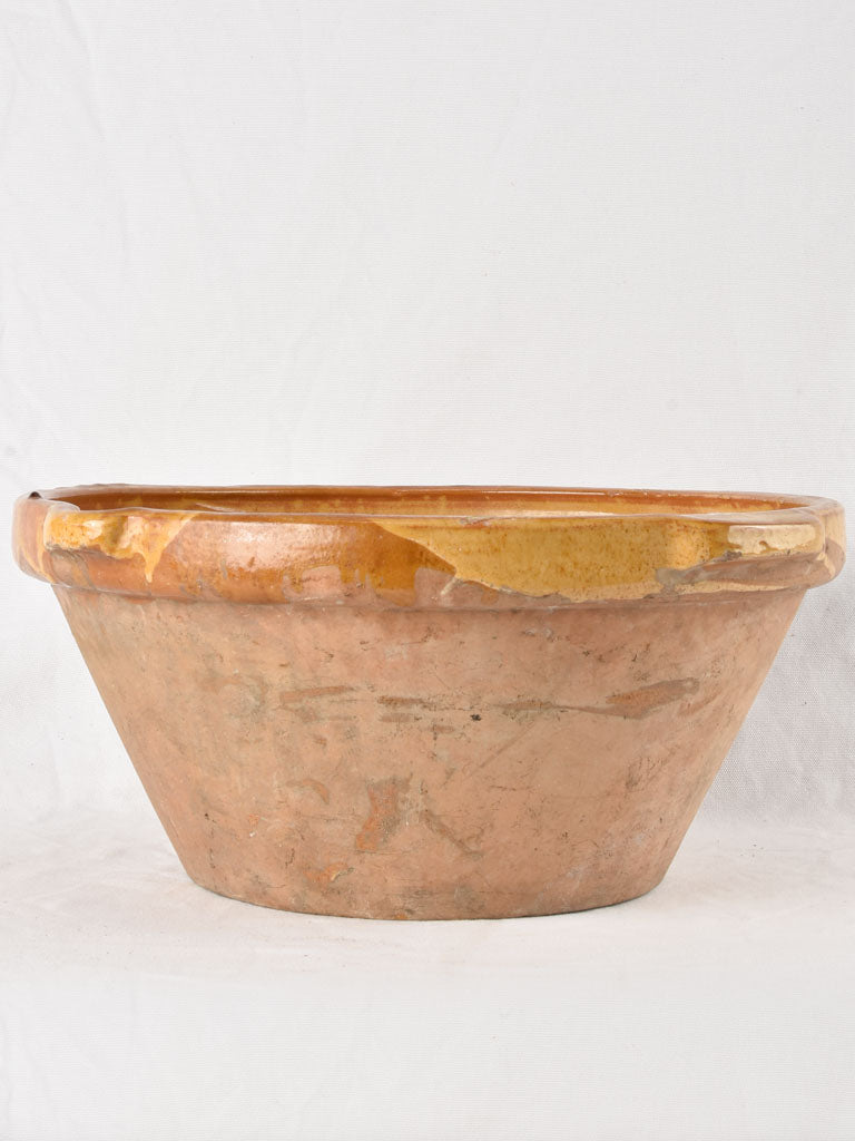 Large antique French bowl with yellow ochre glaze 19"