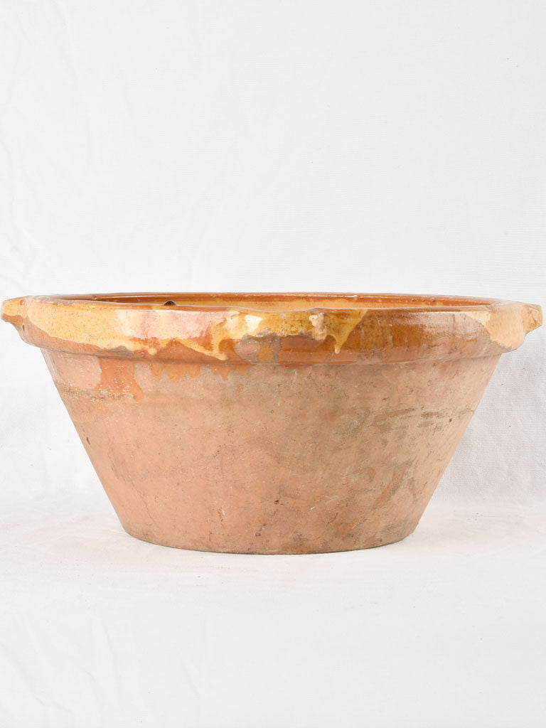 Large antique French bowl with yellow ochre glaze 19"