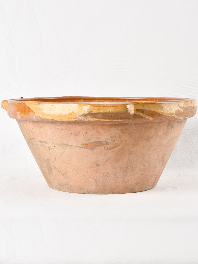 Large antique French bowl with yellow ochre glaze 19"