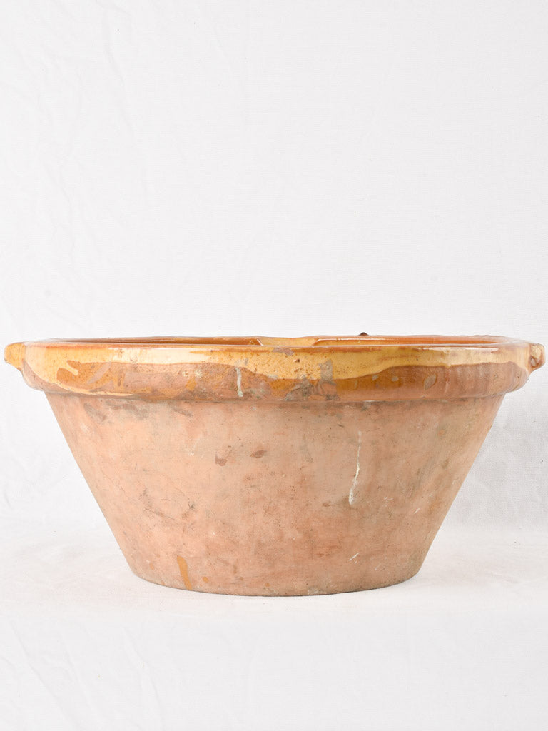 Large antique French bowl with yellow ochre glaze 19"