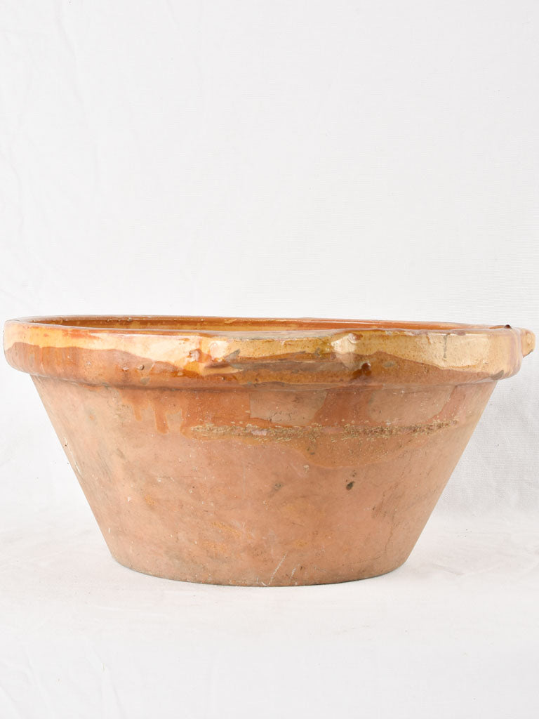 Large antique French bowl with yellow ochre glaze 19"