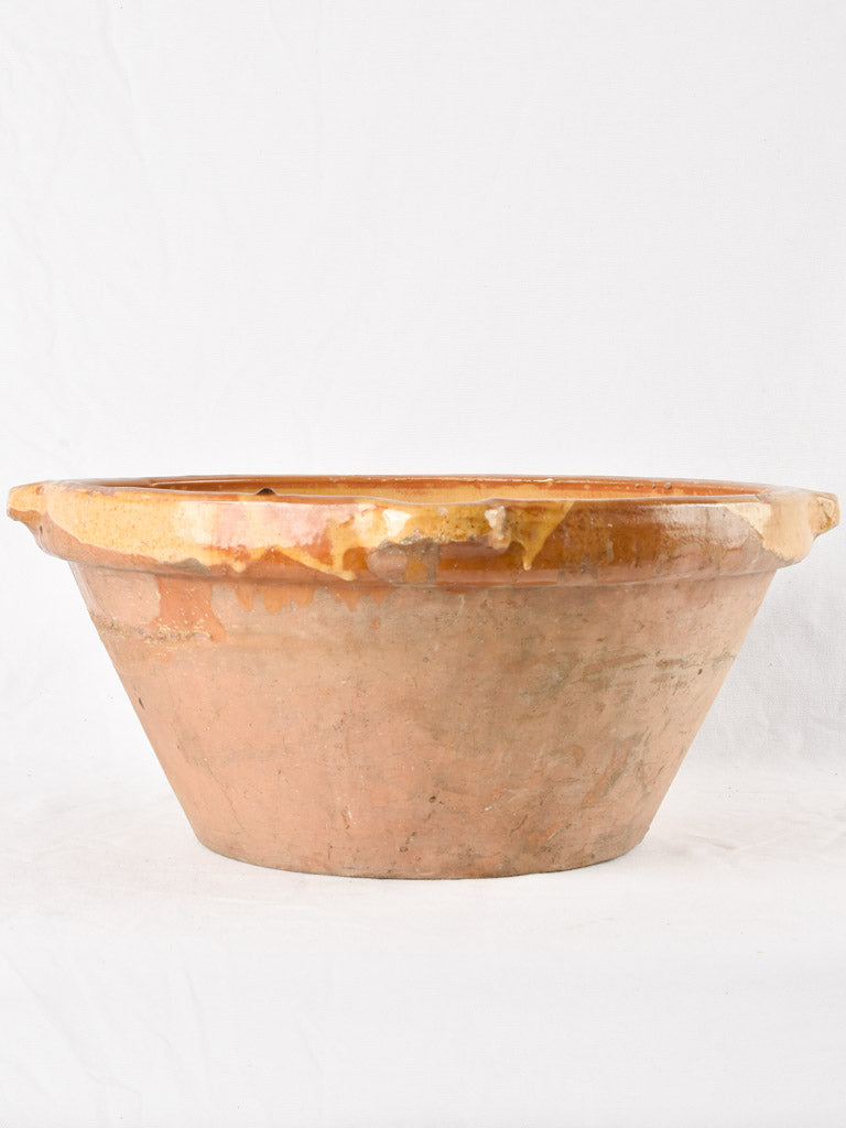 Large antique French bowl with yellow ochre glaze 19"