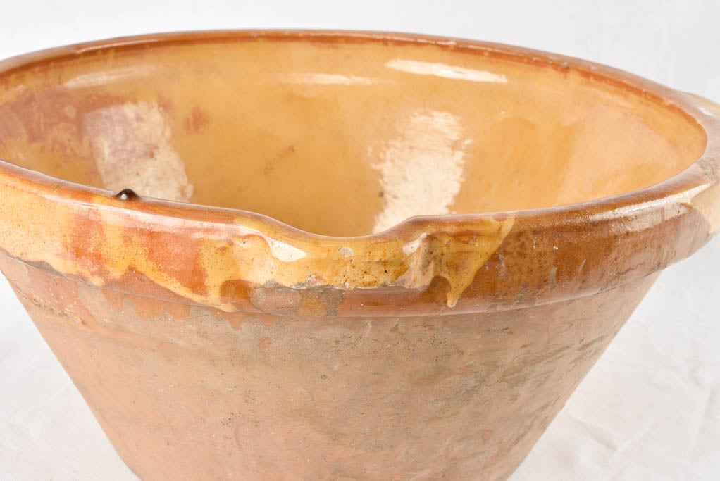 Large antique French bowl with yellow ochre glaze 19"