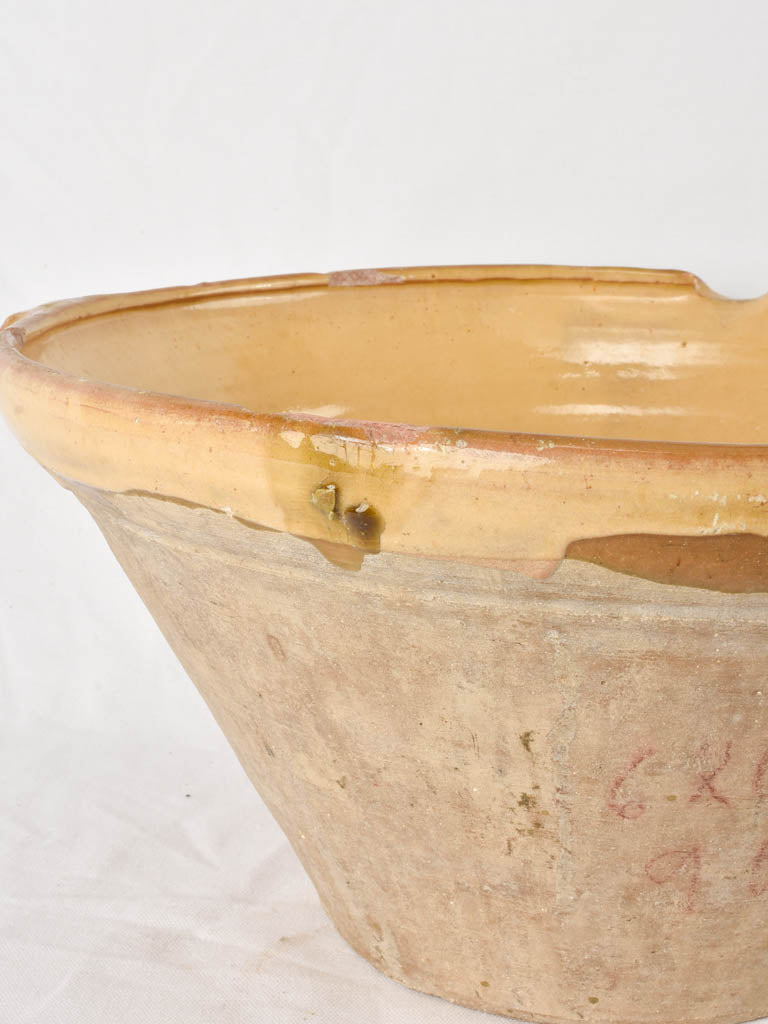 Large antique French bowl with ochre glaze 18"