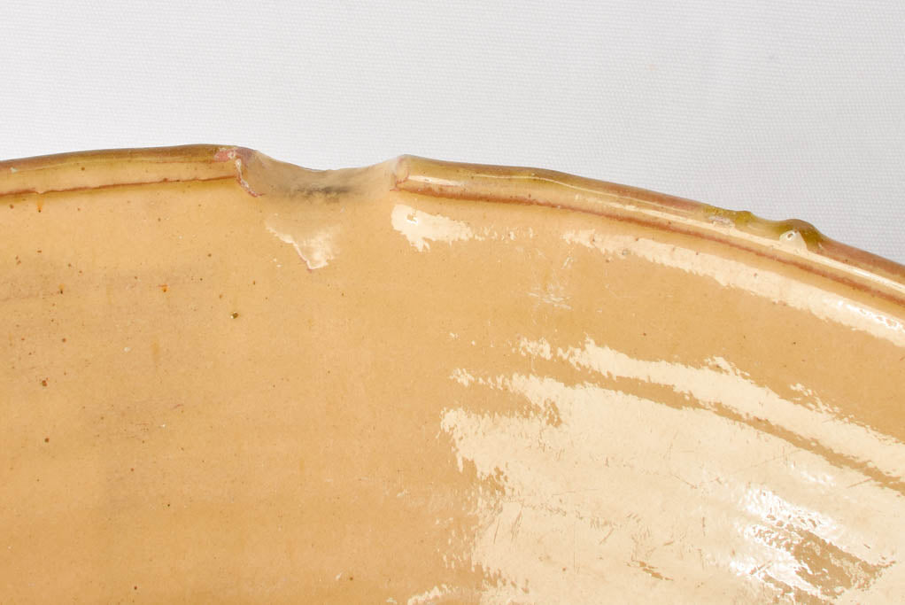 Large antique French bowl with ochre glaze 18"