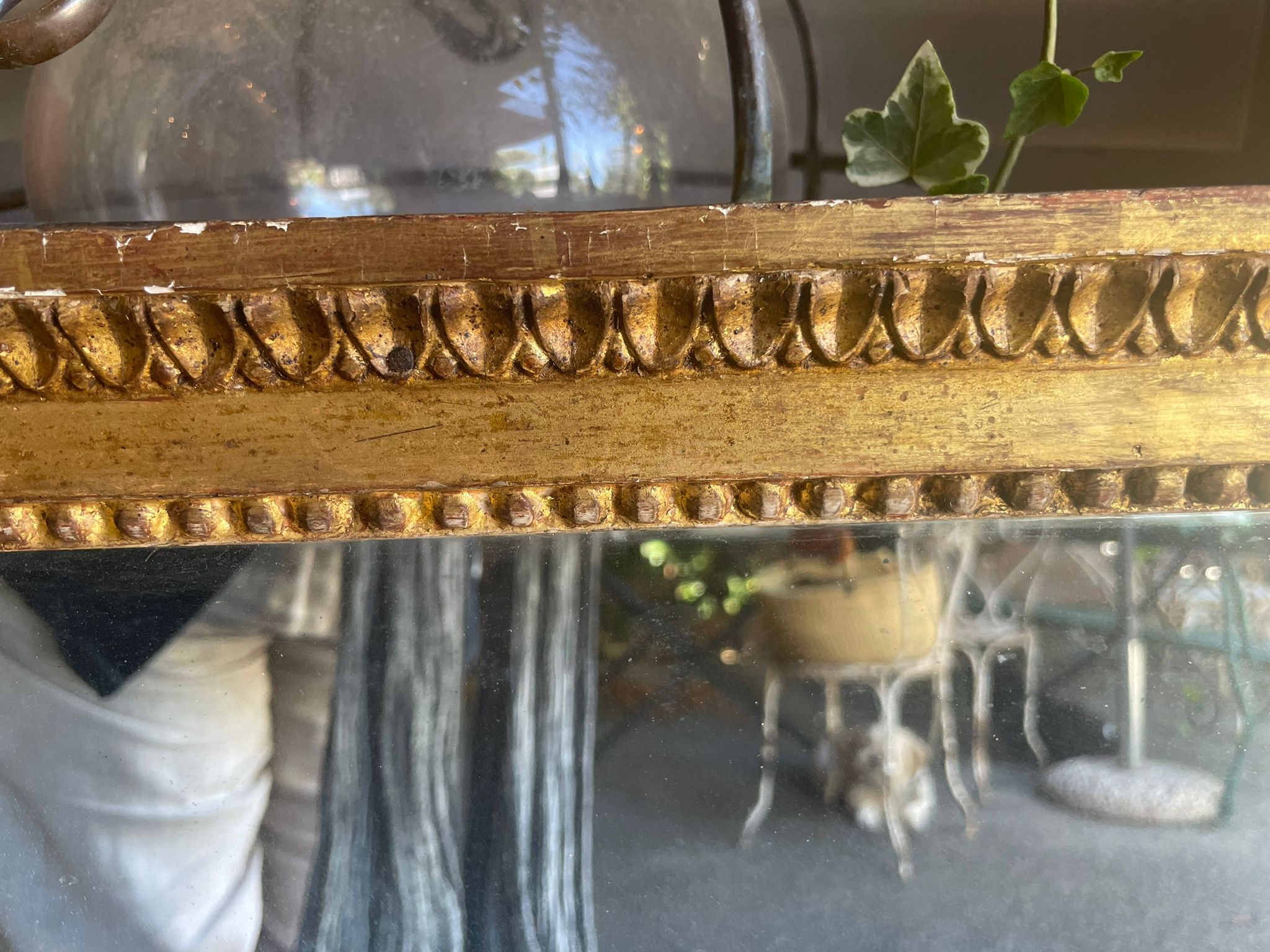 Regal, gilt Louis XVI mirrors