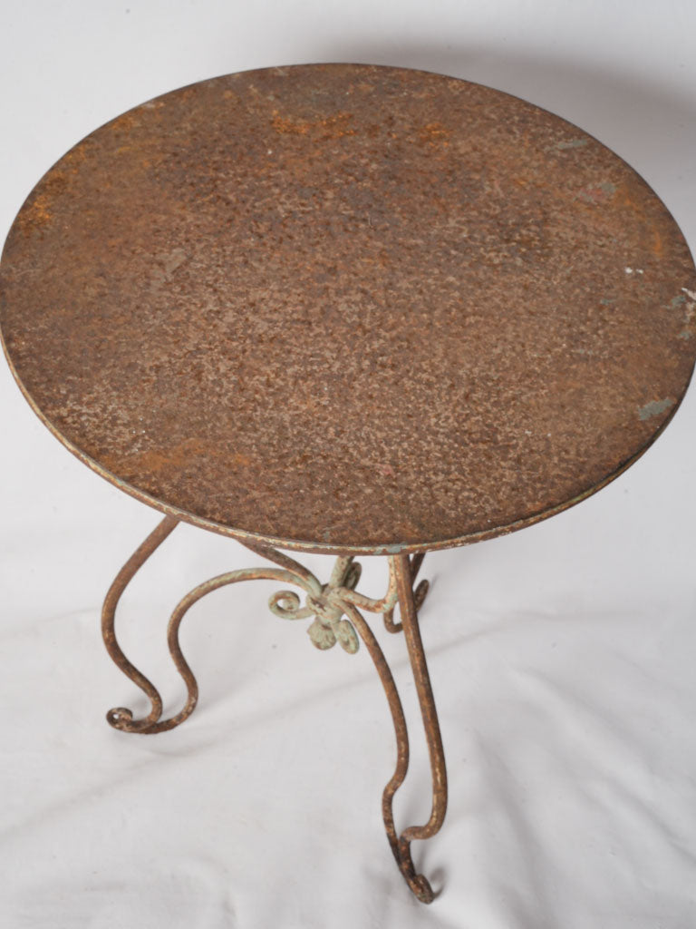 Richly aged wrought iron table