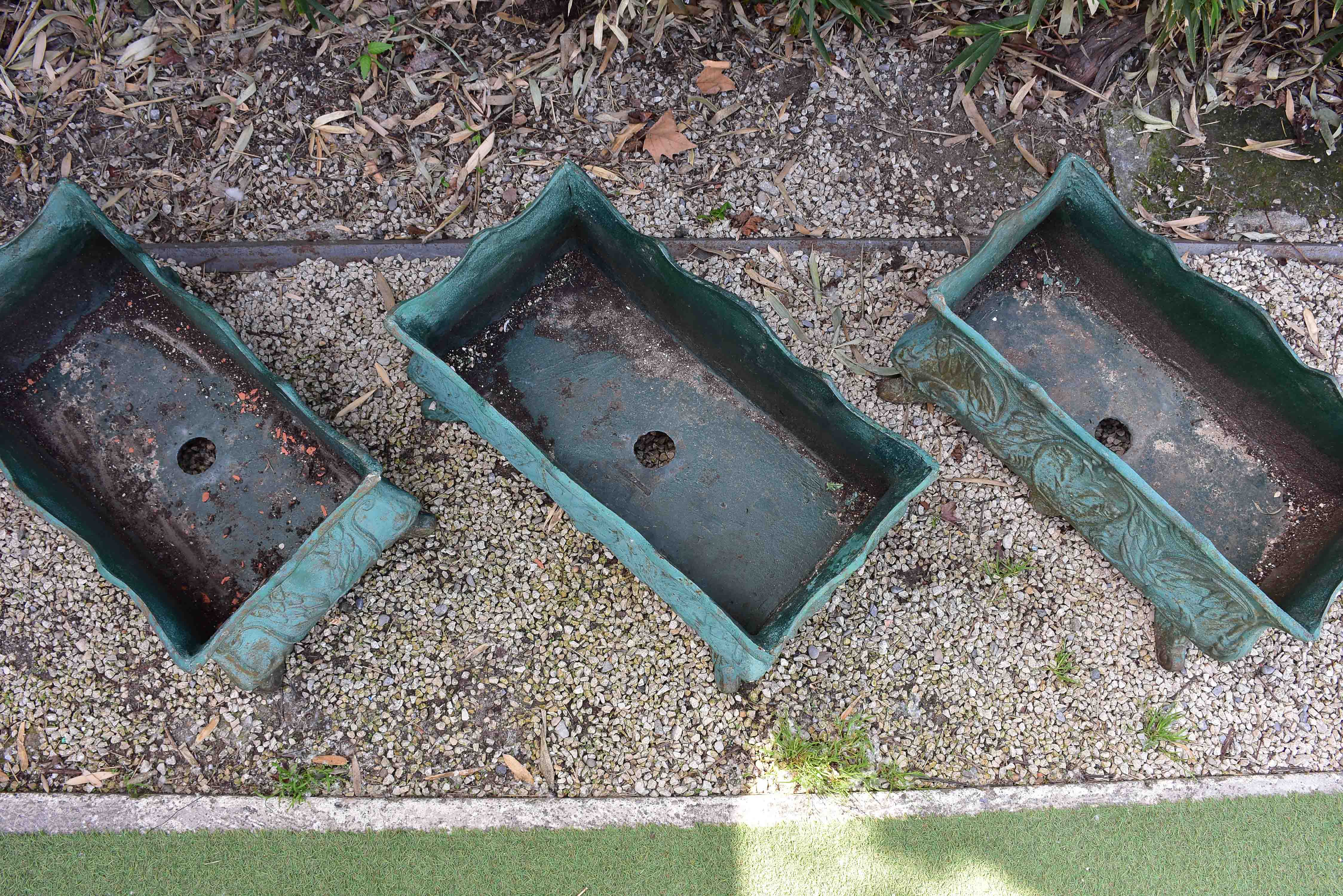 Two antique cast iron French garden planters with green finish