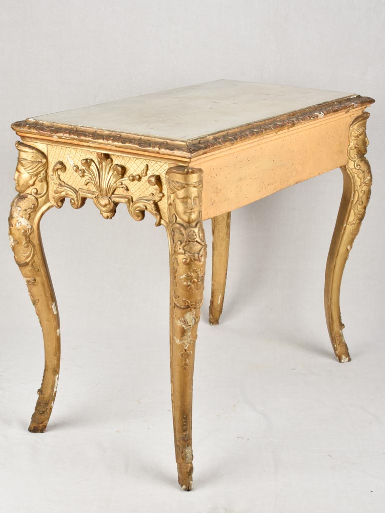 Intricate female mask details console table