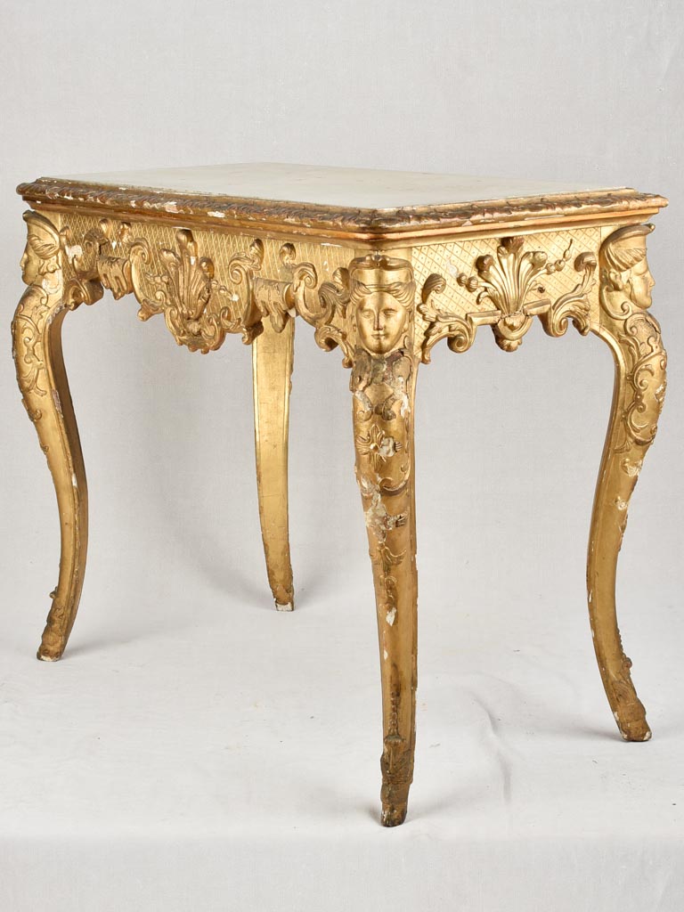 Elegant giltwood and stucco frame table