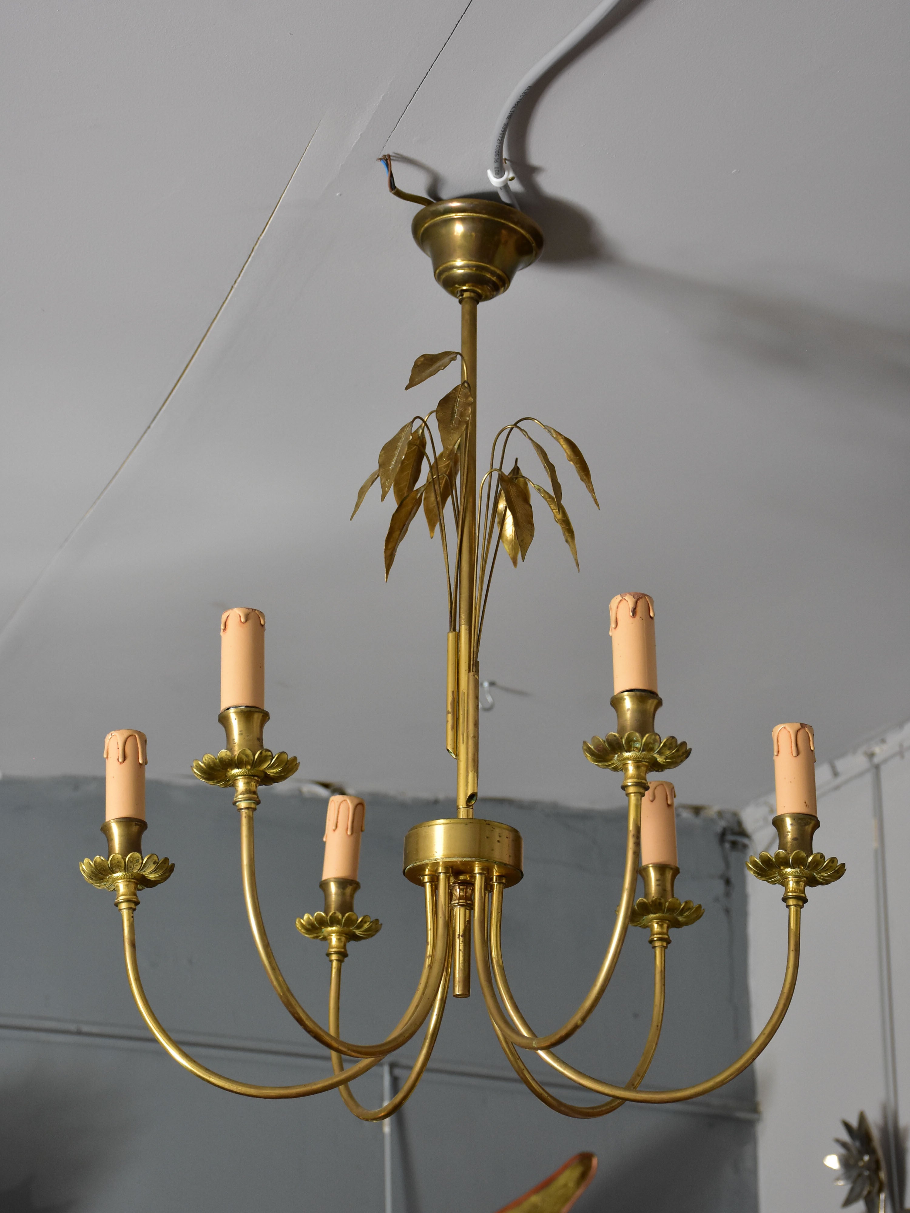 Pair of Maison Charles lustres with bay leaf detail