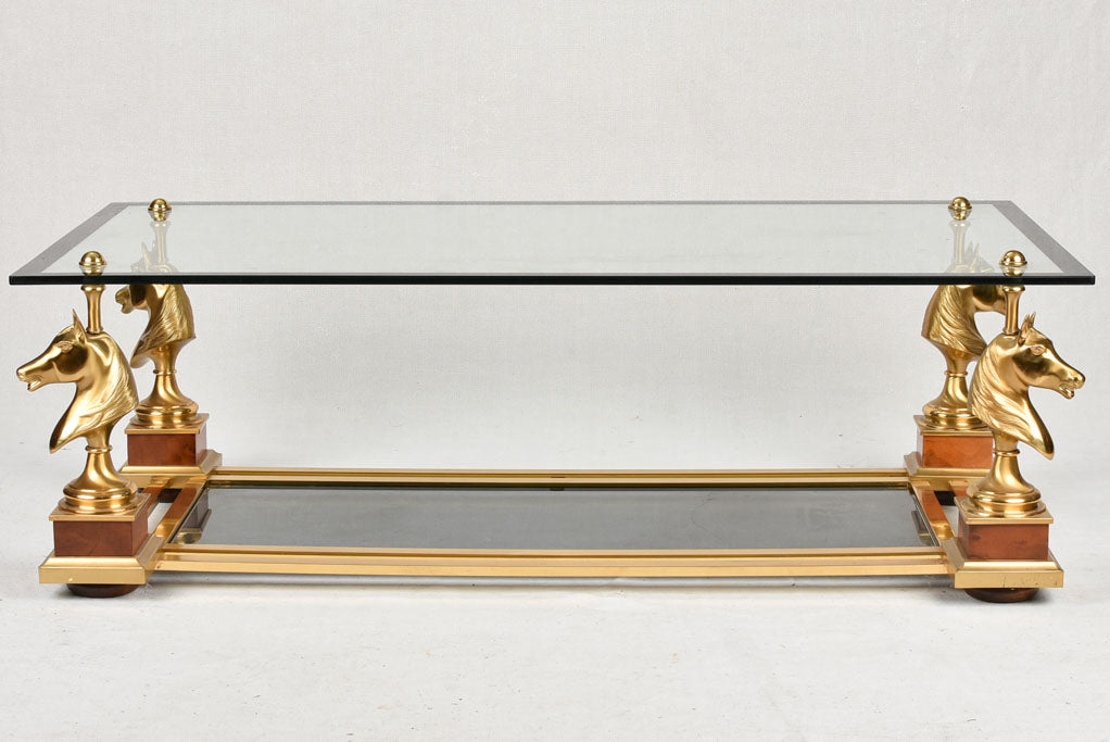 1970s glass coffee table with horse heads 47¾"