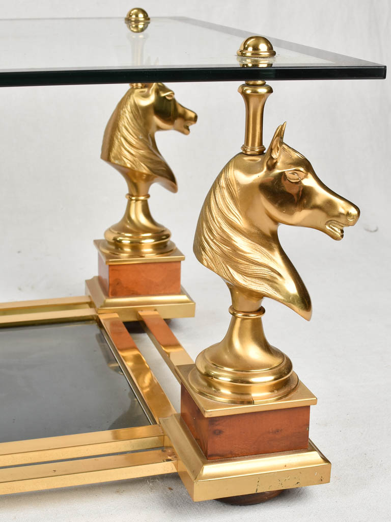 1970s glass coffee table with horse heads 47¾"