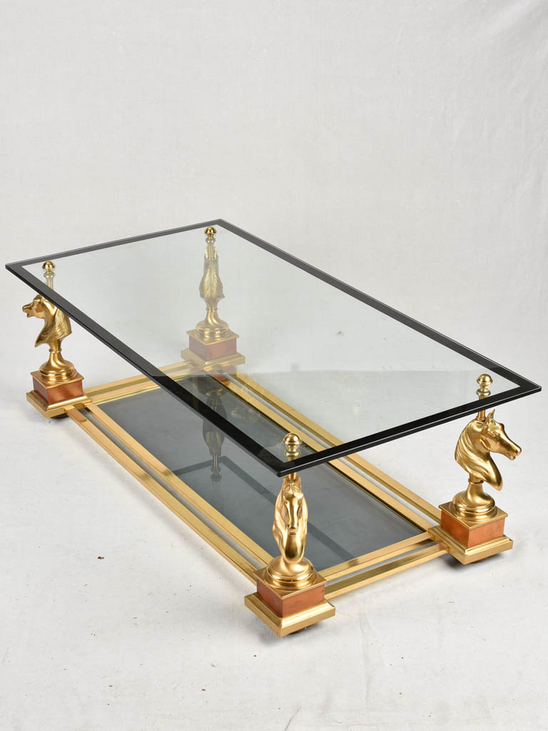 1970s glass coffee table with horse heads 47¾"