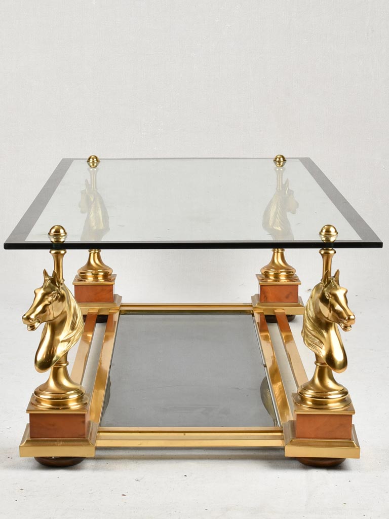 1970s glass coffee table with horse heads 47¾"